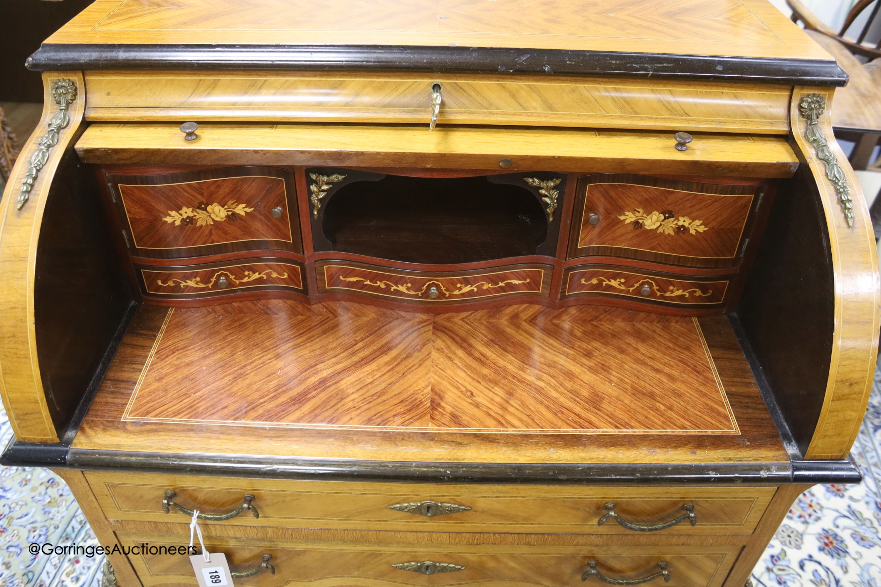 A Louis XVI style marquetry inlaid kingwood cylinder bureau, width 74cm depth 45cm height 102cm